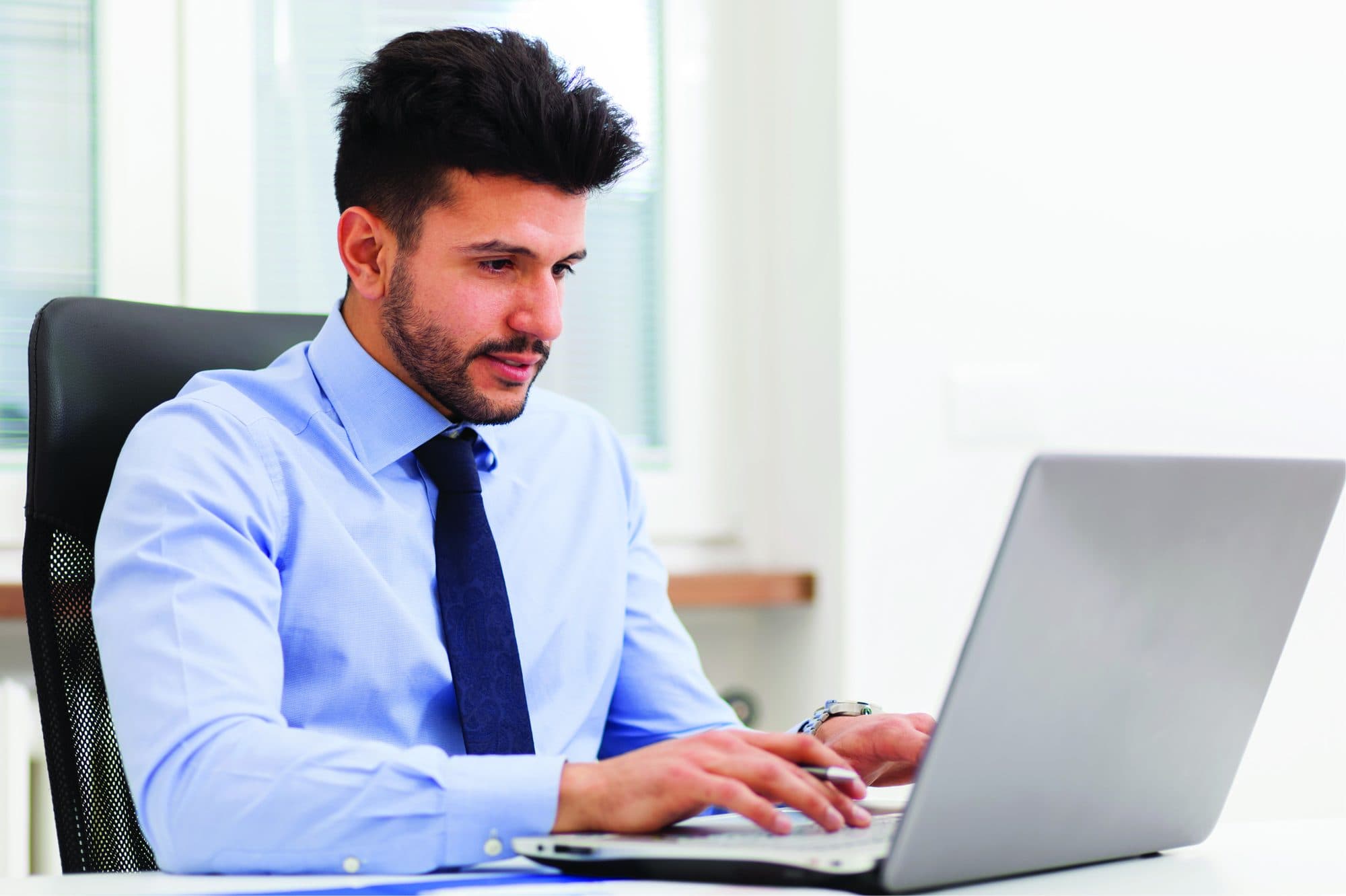 Arjun Mehta at his desk