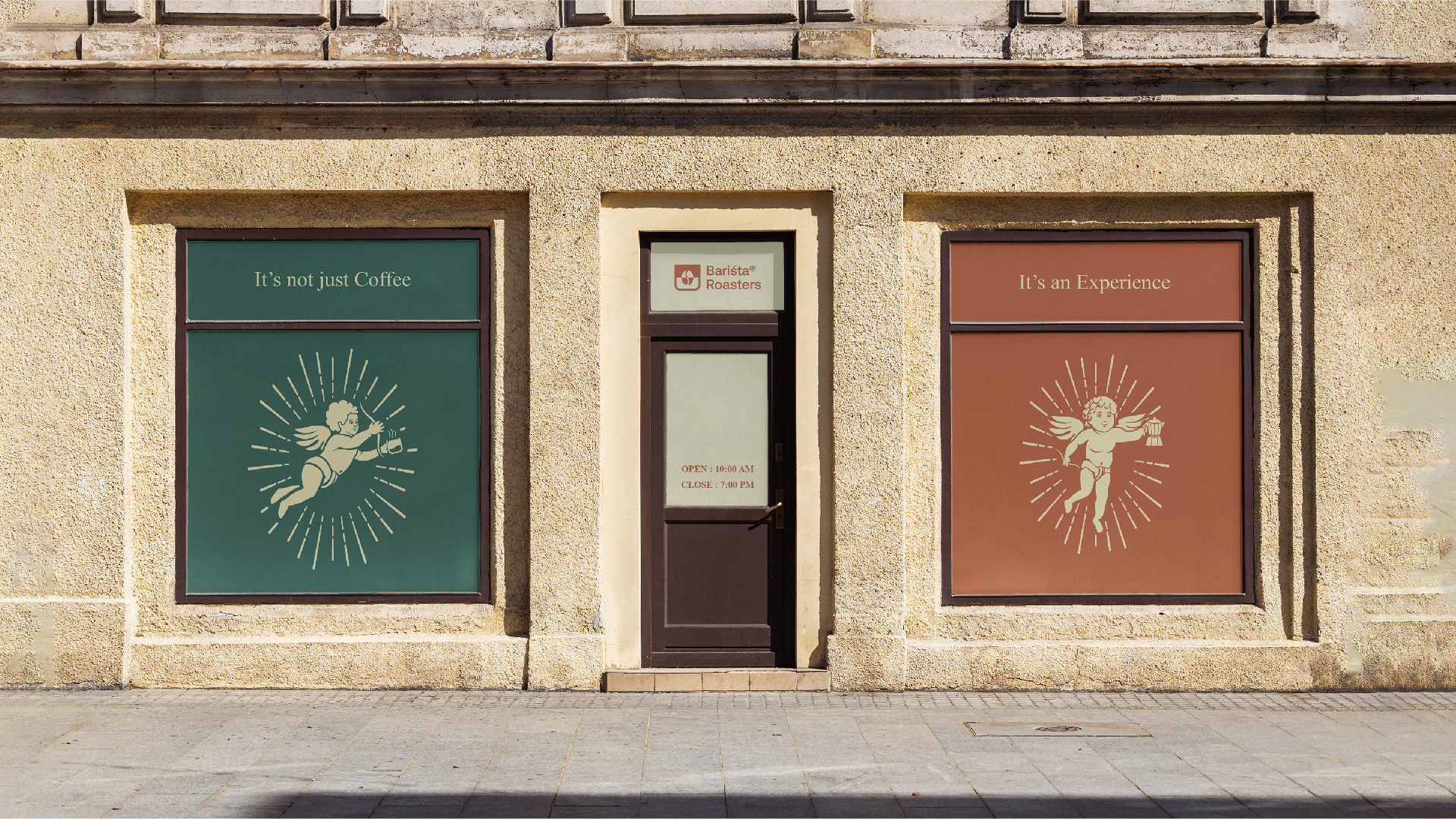 A stone shop front with green and rust cherub windows reading It is not just coffee, It is an experience