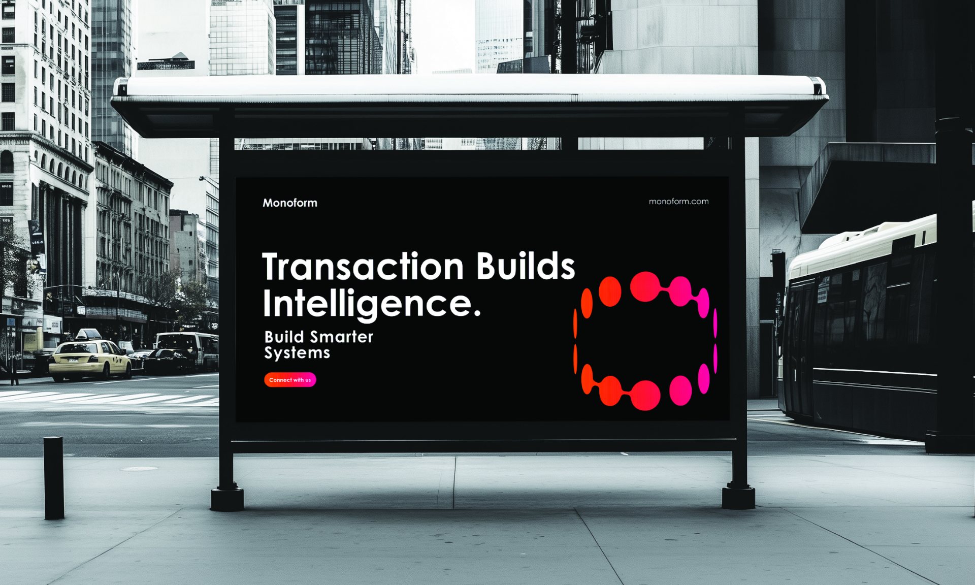 A Monoform poster in a city bus shelter reading Transaction builds intelligence