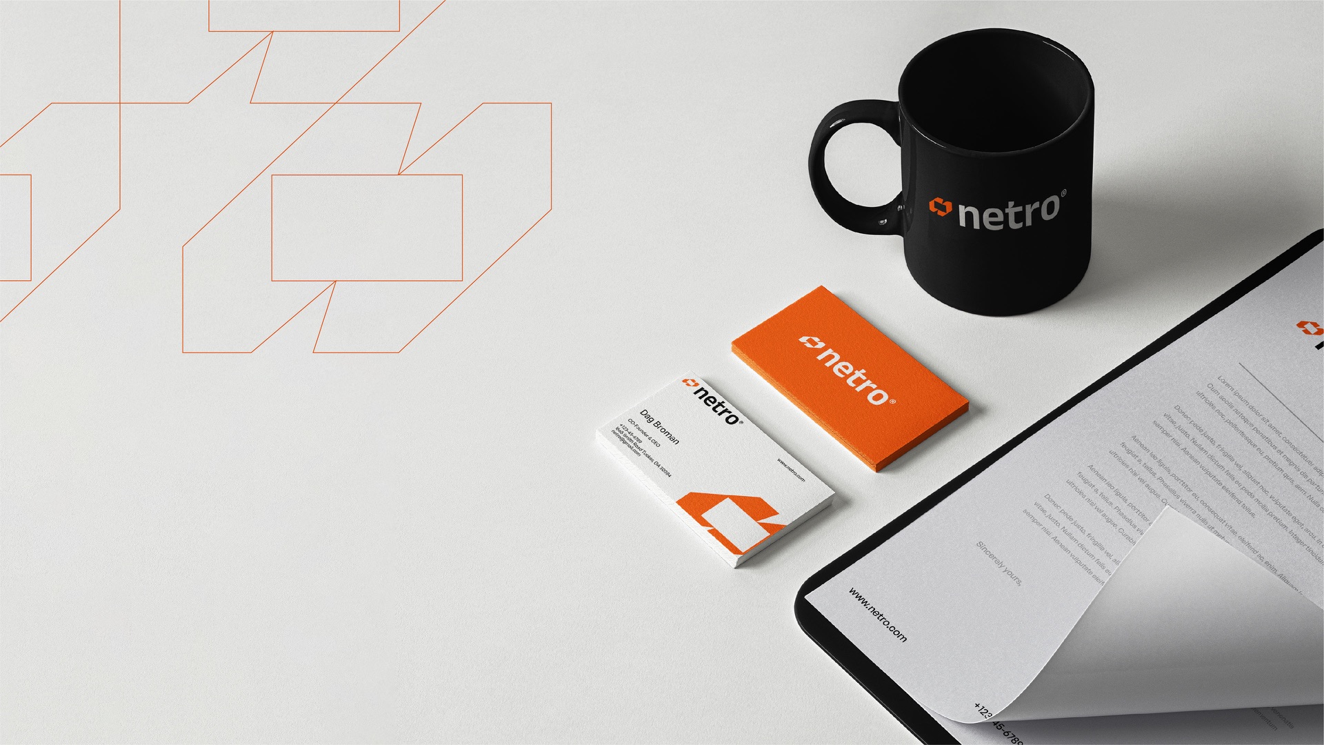 Letterhead, business cards and a black mug on white