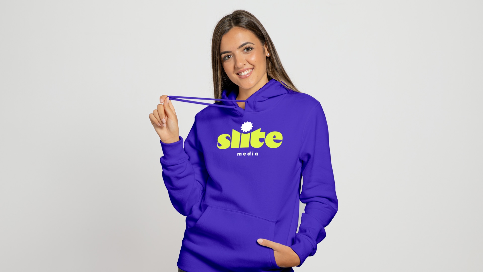 A woman in a purple Slite Media hoodie