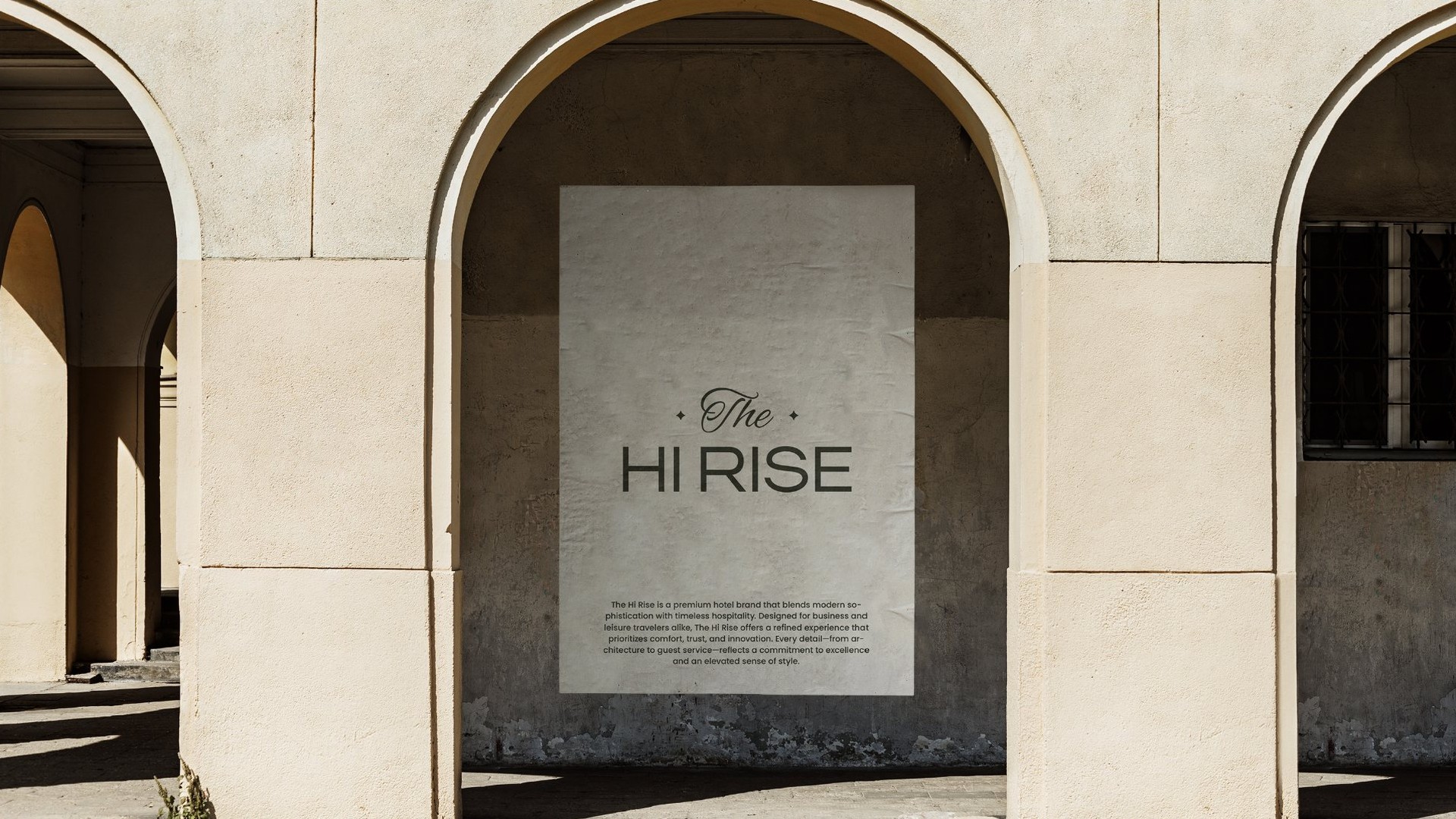 A Hi Rise poster on a stone wall between arches