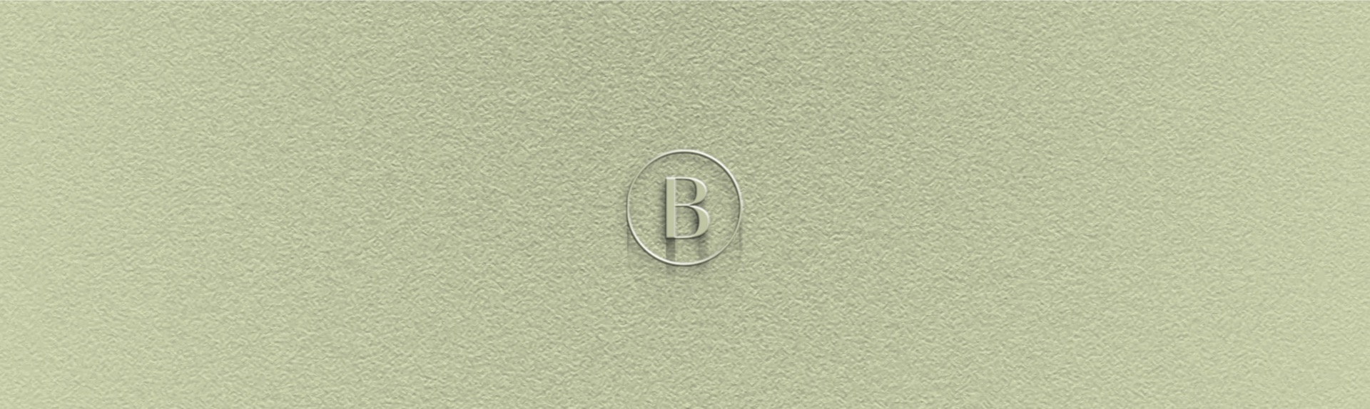 The circled B monogram embossed on sage card