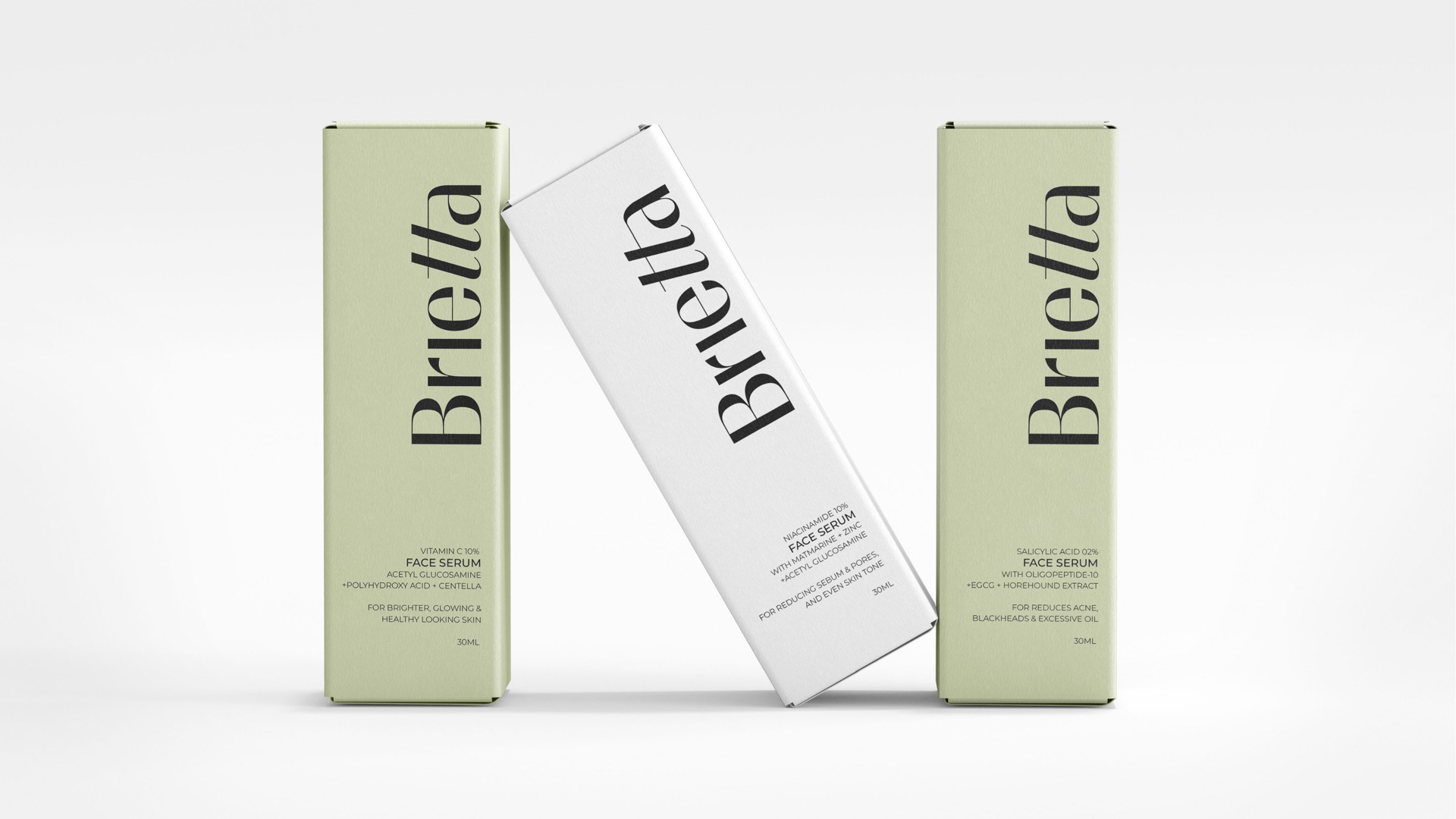 Three face serum cartons standing and leaning on white