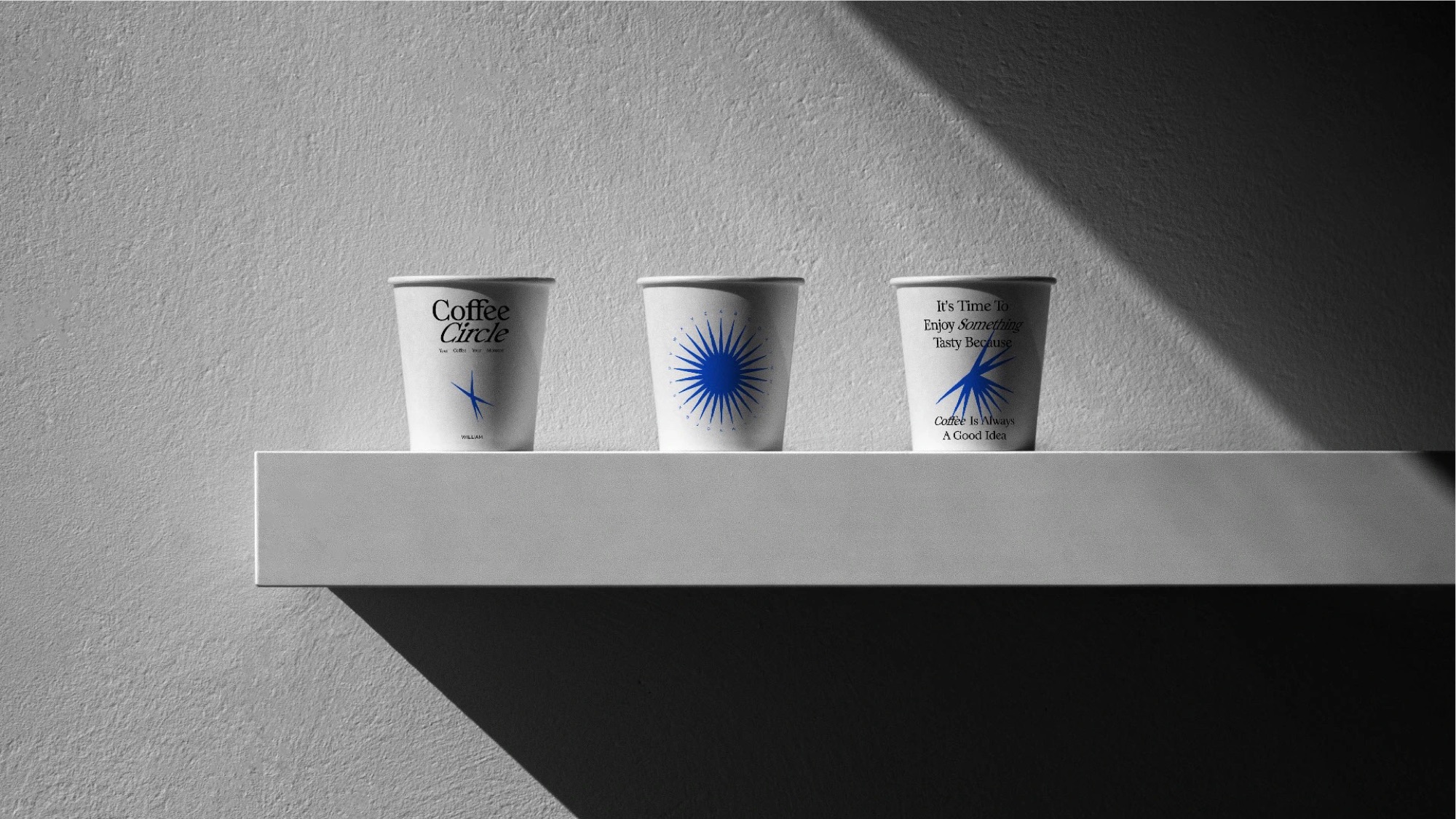 Three cups on a concrete shelf