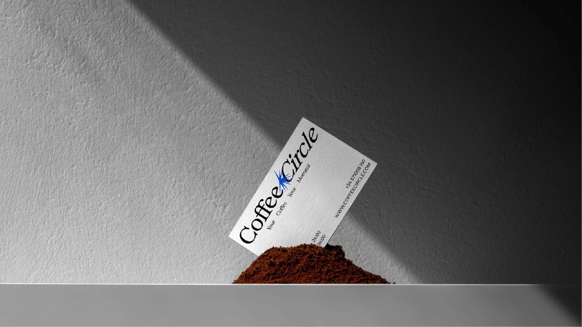 Business card standing in ground coffee