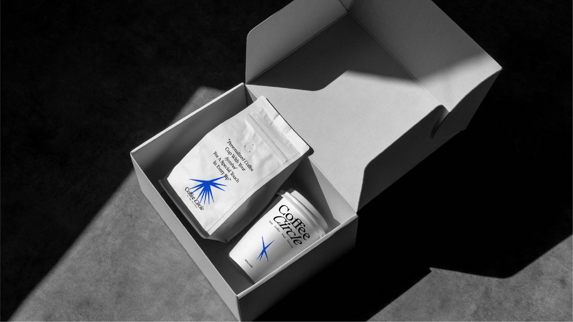 Gift box holding a coffee bag and a cup