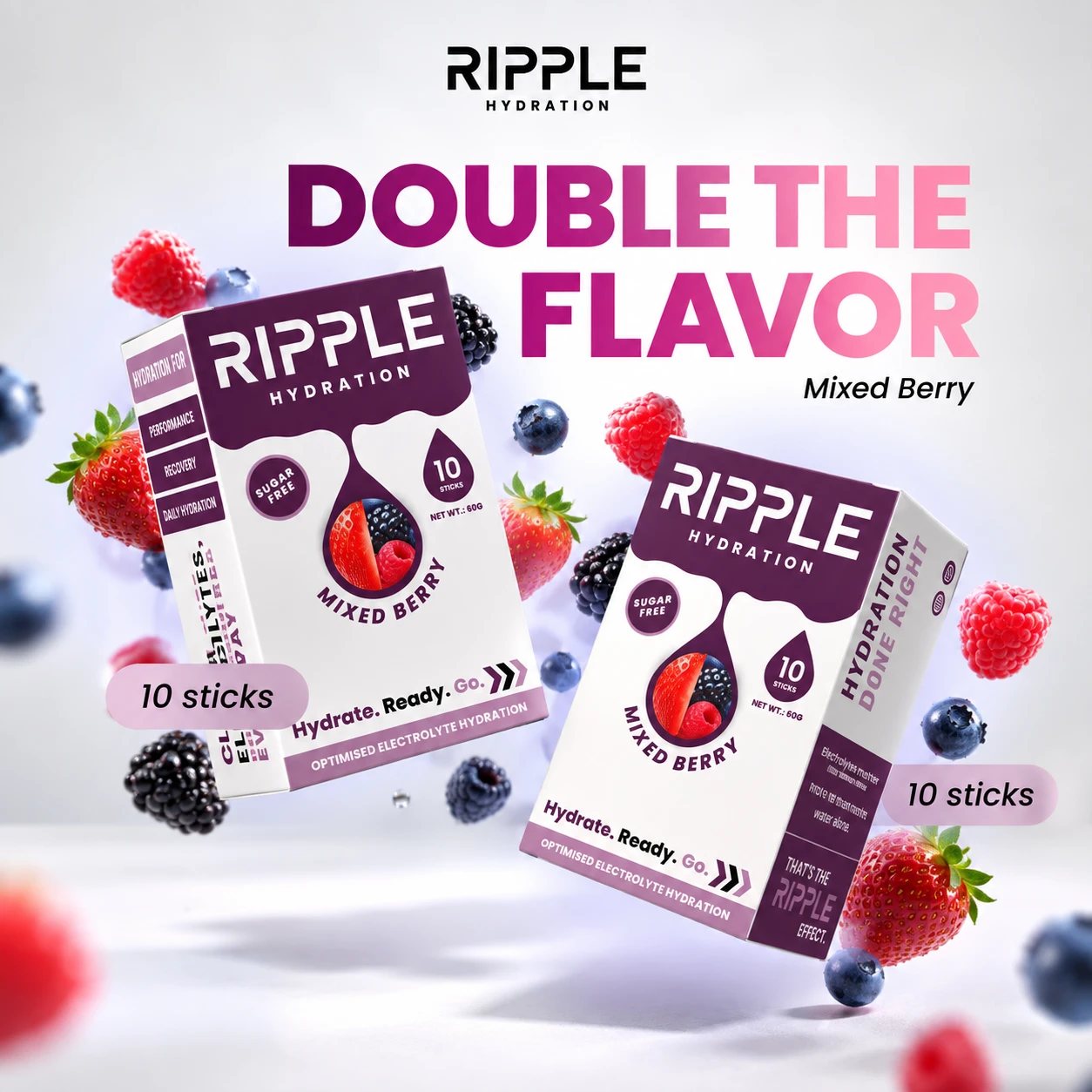 Two Mixed Berry boxes in the air with berries