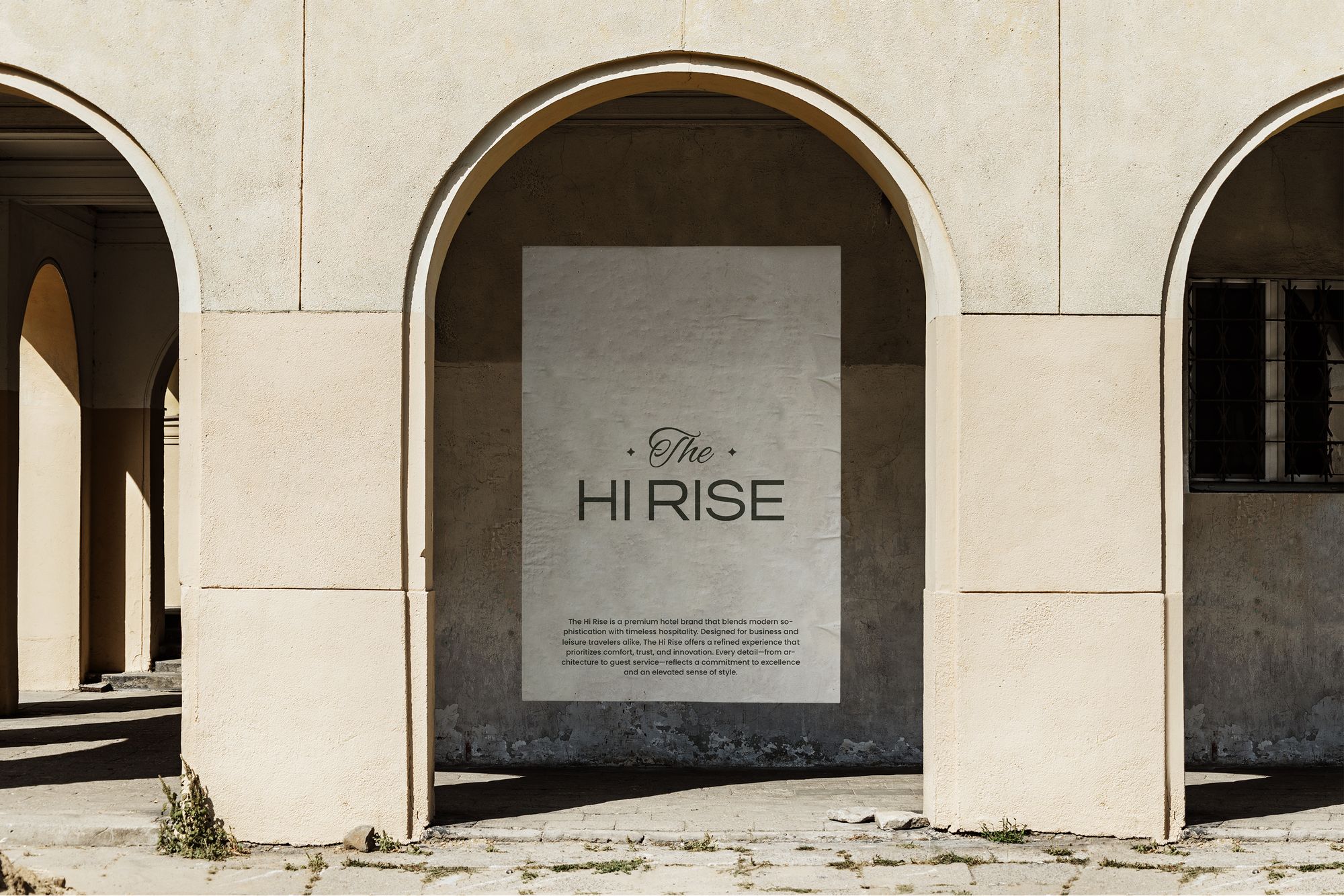 A Hi Rise poster hung in a stone arch